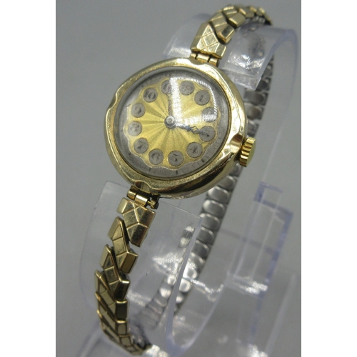 154 - 9ct yellow gold watch engine turned dial with Arabic numerals, Swiss made 14 Jewel movement,  on gol... 