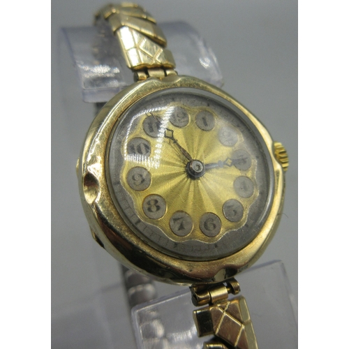 154 - 9ct yellow gold watch engine turned dial with Arabic numerals, Swiss made 14 Jewel movement,  on gol... 