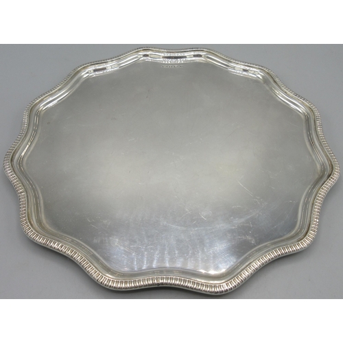 201 - 20th century silver salver with a wavy rim and gadrooned boarder on three shallow stepped feet by Fr... 