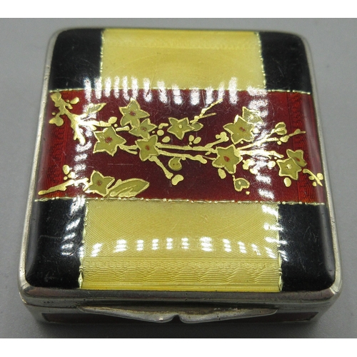 206 - Art Deco silver enamelled pill box in square form, hinged lid decorated in a floral red, yellow and ... 