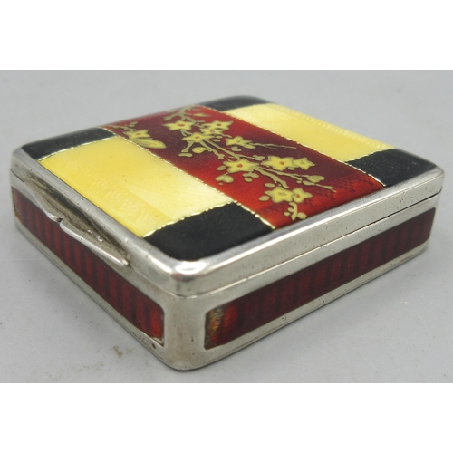 206 - Art Deco silver enamelled pill box in square form, hinged lid decorated in a floral red, yellow and ... 