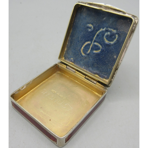 206 - Art Deco silver enamelled pill box in square form, hinged lid decorated in a floral red, yellow and ... 