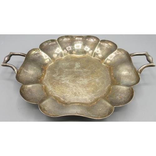 208 - George V silver twin handled dish with a curved scalloped rim, monogrammed with engravings of '1907 ... 