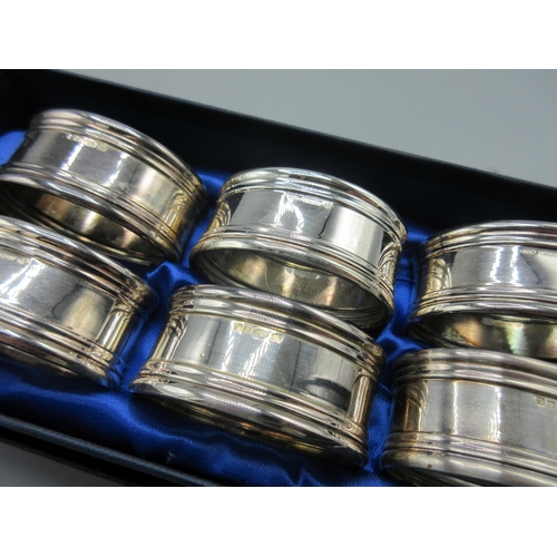 209 - Set of six 21stC silver napkin rings in oval form in presentation box by Victoria Silverware Ltd, 4.... 