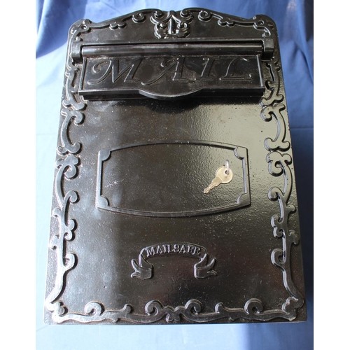 633 - As new, black painted domestic cast metal letter box, with key, H43cm W30cm D25cm