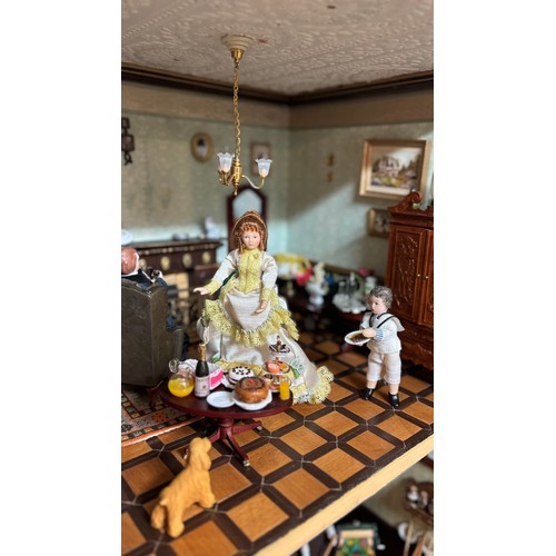 809 - Large late 20th century town house style dolls house, extensively furnished and with a quantity of d... 