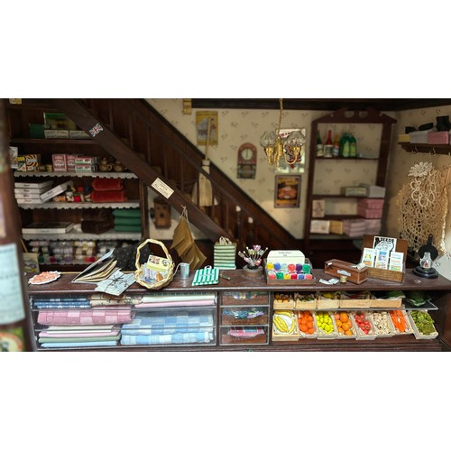 809 - Large late 20th century town house style dolls house, extensively furnished and with a quantity of d... 