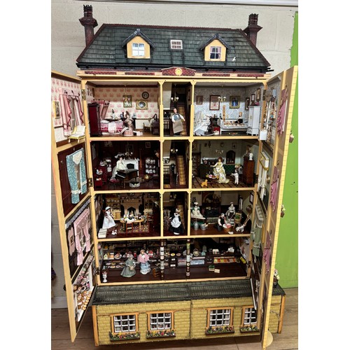 809 - Large late 20th century town house style dolls house, extensively furnished and with a quantity of d... 