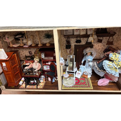 809 - Large late 20th century town house style dolls house, extensively furnished and with a quantity of d... 