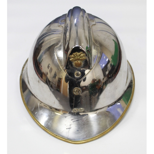 1607 - Type 1933 Air Force Aviation Fire Fighters Helmet. Chrome plated with brass rim. Flaming bomb in bra... 