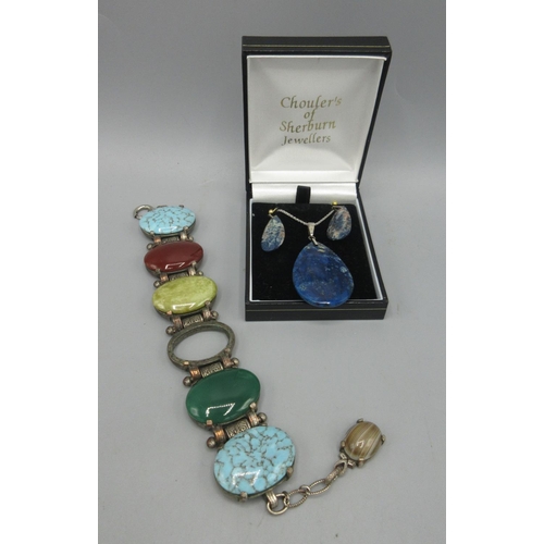 63 - White metal bracelet set with polished stones, including turquoise, cornelian and agate, AF, a polis... 