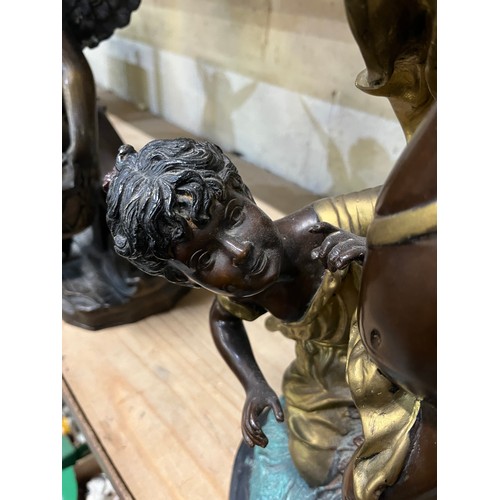 662 - After Auguste Moreau, a hollow bronze sculpture, of a blindfolded cherub and a girl, H59.5cm