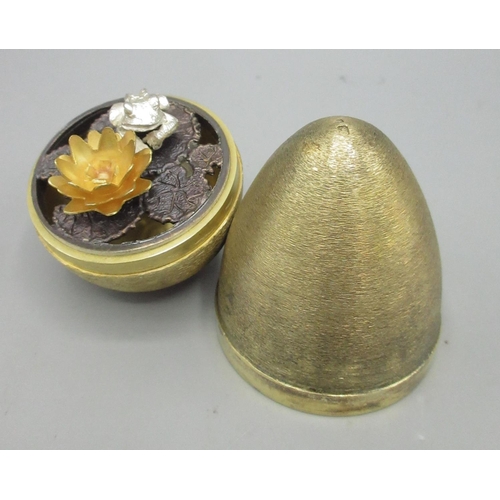 656 - Stuart Delvin surprise-egg, London, 1972, in a textured effect, opening to reveal a frog on a lily p... 