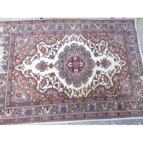 813 - Persian pattern multicoloured rug, field with central medallion in repeating border, 160cm x 120cm