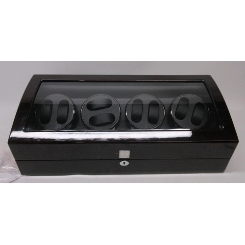 297 - As new Xtelary rosewood finish watch winder and display case, no power supply, W64.5cm and three wat... 