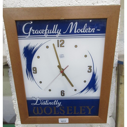 1211 - Wolseley Sectric perspex showroom wall clock, later quartz movement and frame, H42cm W34cm