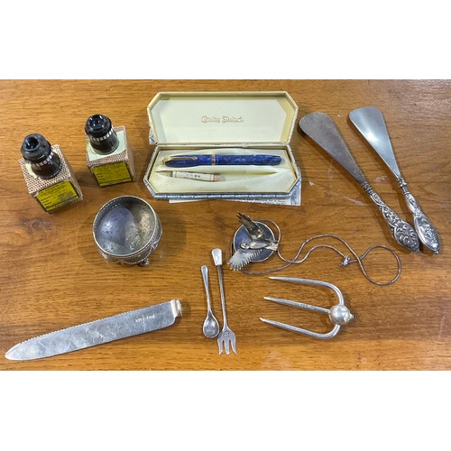 183 - Two hallmarked silver handled steel shoe horns, a silver bread knife and fork (no handles), silver m... 