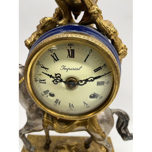 668 - Hermle Louis XV style mantel clock, drum head case gilt metal base in the form of horse with porcela... 