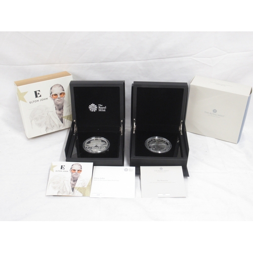 The Royal Mint - Elton John 2020 UK 5oz Silver Proof Coin, Limited Edition No.003/425, encapsulated in case with COA & The Britannia 2021 UK 5oz Silver Proof Coin, Limited Edition No.089/250, encapsulated in case with COA (2)