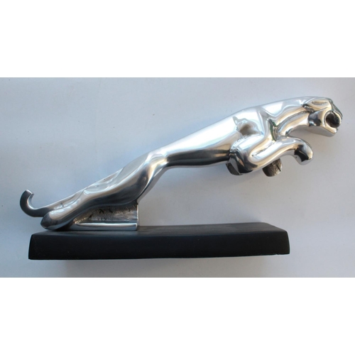 378 - Chrome Jaguar mascot on metal plinth. 38cm head to tail.