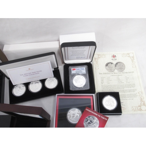 107 - Collection of 18 1oz Silver Proof coins, encapsulated in cases, some with COA's