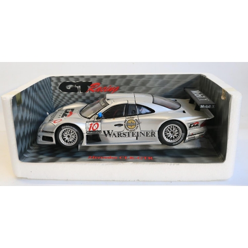 36 - Seven boxed 1/18 scale diecast car models to include a Ricko Austin 7 (excellent condition, not atta... 