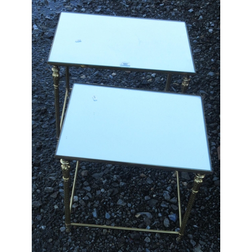 582 - Graduated pair of rectangular mirror topped coffee tables on gilt metal supports, W55cm D39cm H44cm ... 