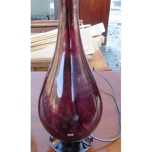 593 - Pair of red glass bottle shaped table lamps and a similar purple lamp, all with black shades, H74cm ... 