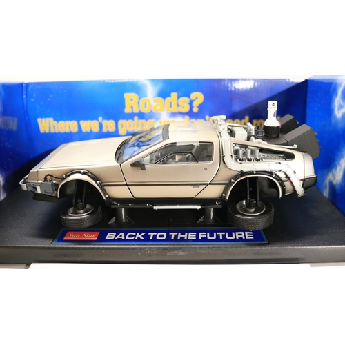 44 - Two boxed 1/18 scale well detailed diecast DeLorean car models from the motion picture Back To The F... 