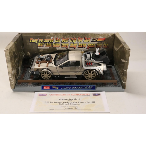 45 - Two boxed 1/18 scale well detailed diecast DeLorean car models from the motion picture Back To The F... 