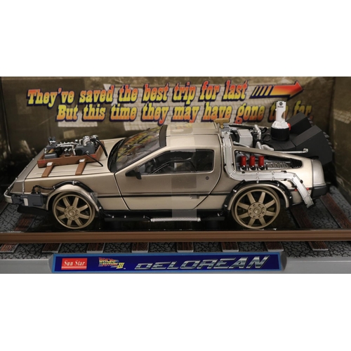 45 - Two boxed 1/18 scale well detailed diecast DeLorean car models from the motion picture Back To The F... 