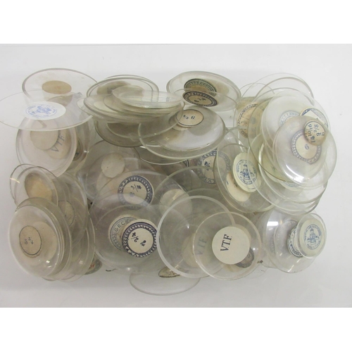 243 - Ten containers containing early 20th Century pocket watch and fob watch glasses