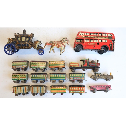 74 - Interesting collection of small vintage tinplate toys to include a Brimtoy Pocketoy clockwork bus (m... 