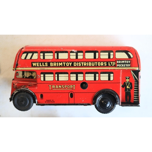 74 - Interesting collection of small vintage tinplate toys to include a Brimtoy Pocketoy clockwork bus (m... 