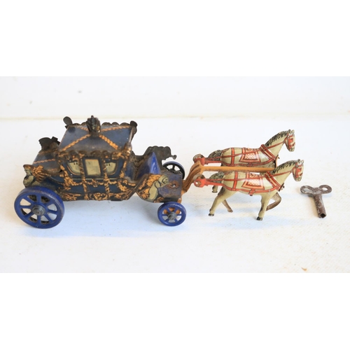 74 - Interesting collection of small vintage tinplate toys to include a Brimtoy Pocketoy clockwork bus (m... 