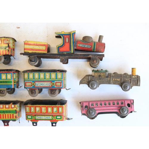 74 - Interesting collection of small vintage tinplate toys to include a Brimtoy Pocketoy clockwork bus (m... 