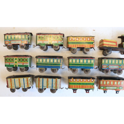 74 - Interesting collection of small vintage tinplate toys to include a Brimtoy Pocketoy clockwork bus (m... 