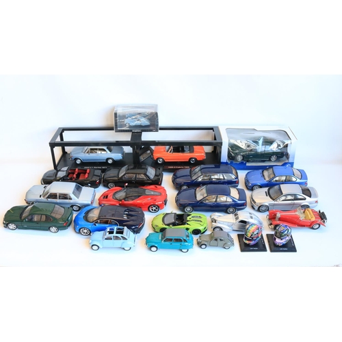 77 - Collection of mostly unboxed 1/18 scale diecast BMW car models, various manufacturers to include Sol... 