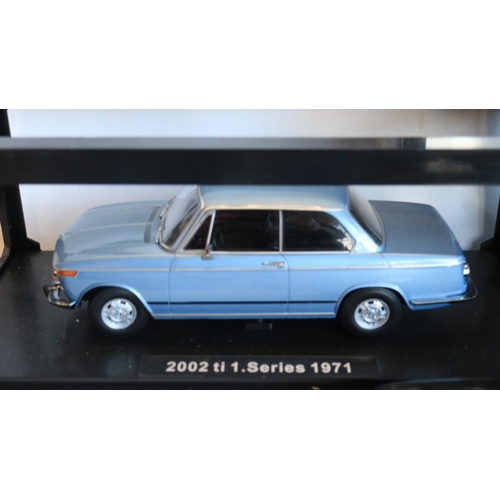 77 - Collection of mostly unboxed 1/18 scale diecast BMW car models, various manufacturers to include Sol... 