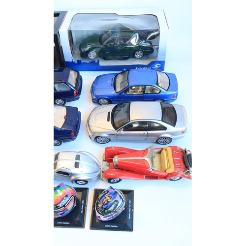 77 - Collection of mostly unboxed 1/18 scale diecast BMW car models, various manufacturers to include Sol... 