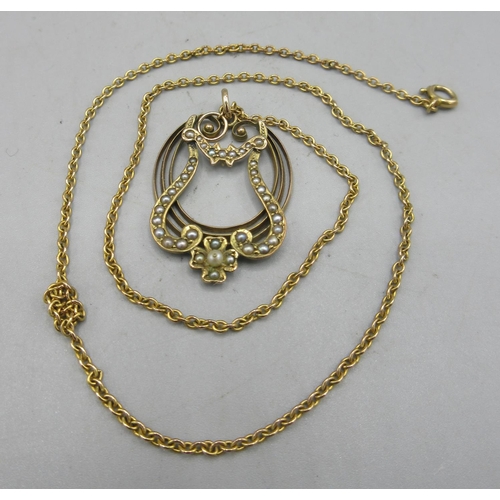 28 - Edwardian 9ct yellow gold seed pearl pendant, on 9ct yellow gold chain, both stamped 9ct, 6.0g