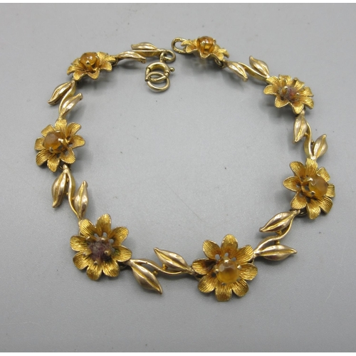 48 - 9ct yellow gold bracelet made up of flowers set with citrine centre, stamped 375, L19cm, 12.0g