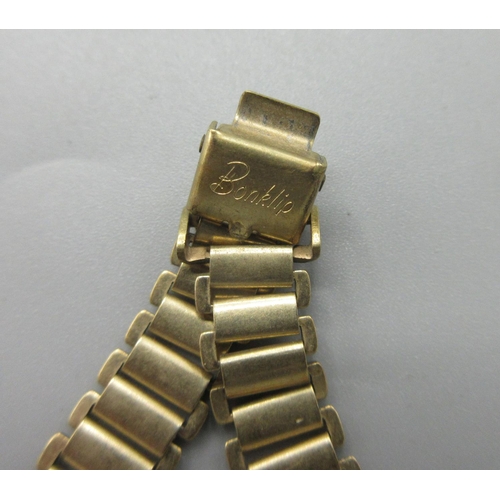 7 - Wristwatch with 9ct yellow gold case, stamped 375, on rolled gold bracelet, gross 24.6g