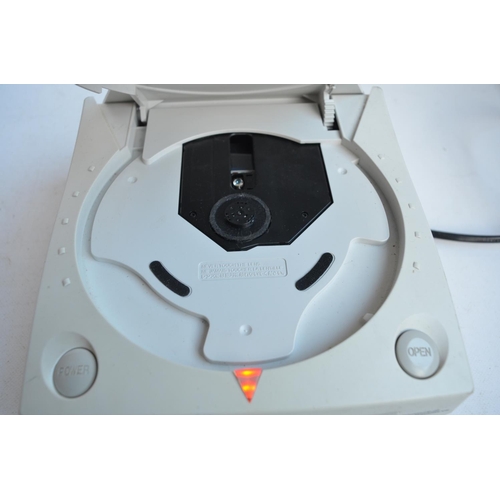 337 - Sega Dreamcast games console with one standard controller and a Fission Fishing Controller from Inte... 