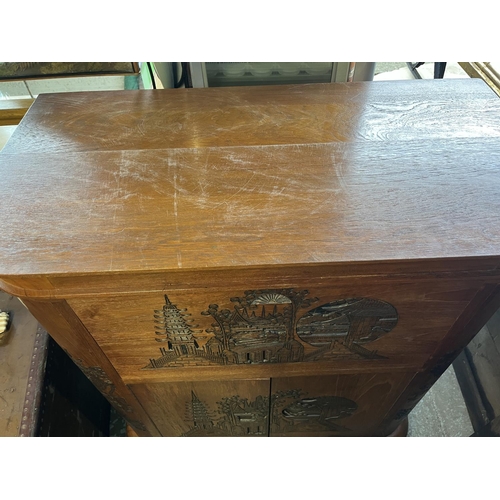 709 - Chinese carved cocktail cabinet, hinged top with fitted interior above two drawers, W90cm D50cm H105... 