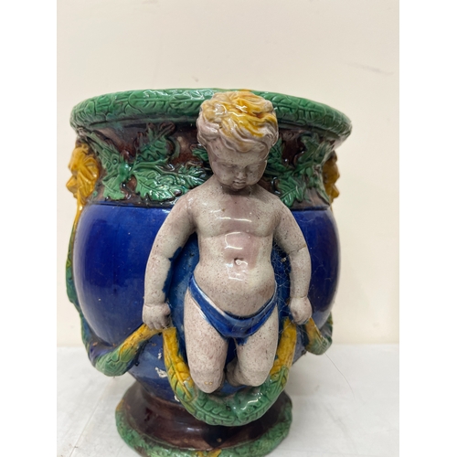 176 - Minton style majolica jardiniere with moulded cherubs and lion masks, lozenge to underside, H26cm