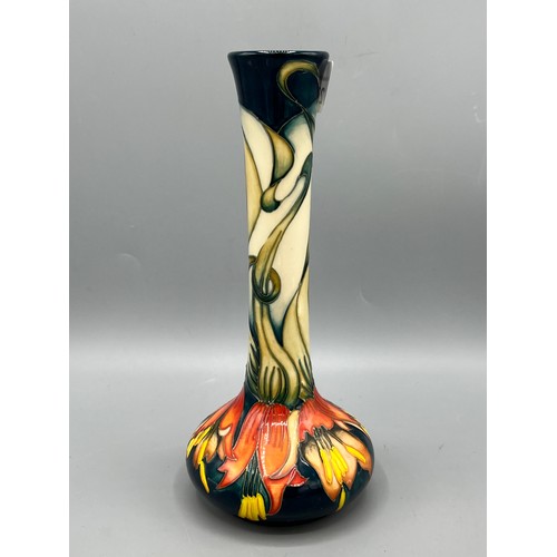 275 - Moorcroft vase, featuring a pattern of stylized flowers in orange and yellow, dated 2010, H21cm