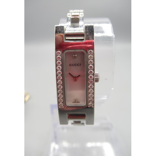 663 - Gucci ladies stainless steel and diamond quartz wristwatch, signed Mother of Pearl dial, signed snap... 