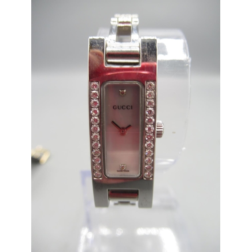 663 - Gucci ladies stainless steel and diamond quartz wristwatch, signed Mother of Pearl dial, signed snap... 