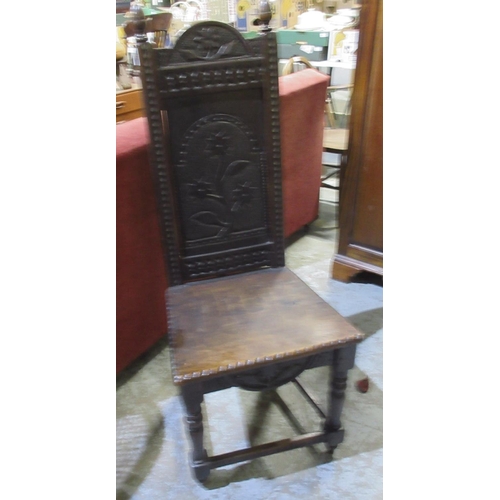 612 - Victorian oak hall chair, floral carved back with acorn finials and solid seat with chip carved deta... 